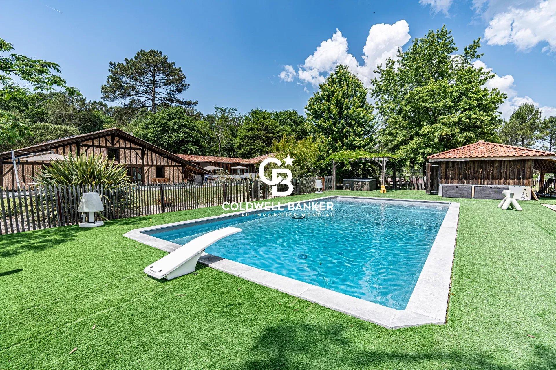 Propriété familiale sur un parc de 6500 m² avec piscine et terrain de tennis à vendre à Saint-Geours-de-Maremne