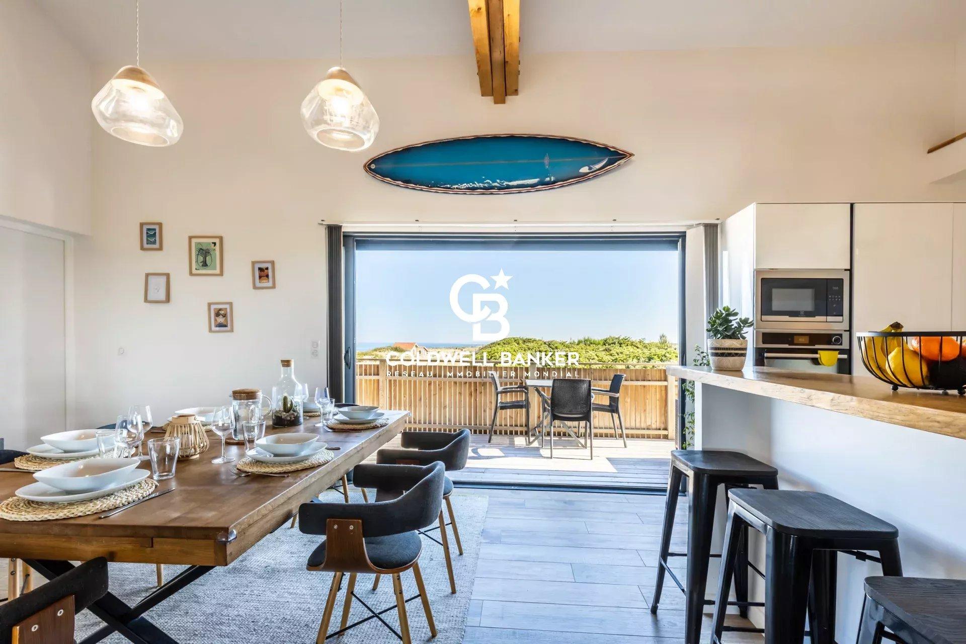 Maison à vendre à Ondres – ensemble immobilier en première ligne, vue océan, maison contemporaine 6 chambres, piscine, garage et murs commerciaux